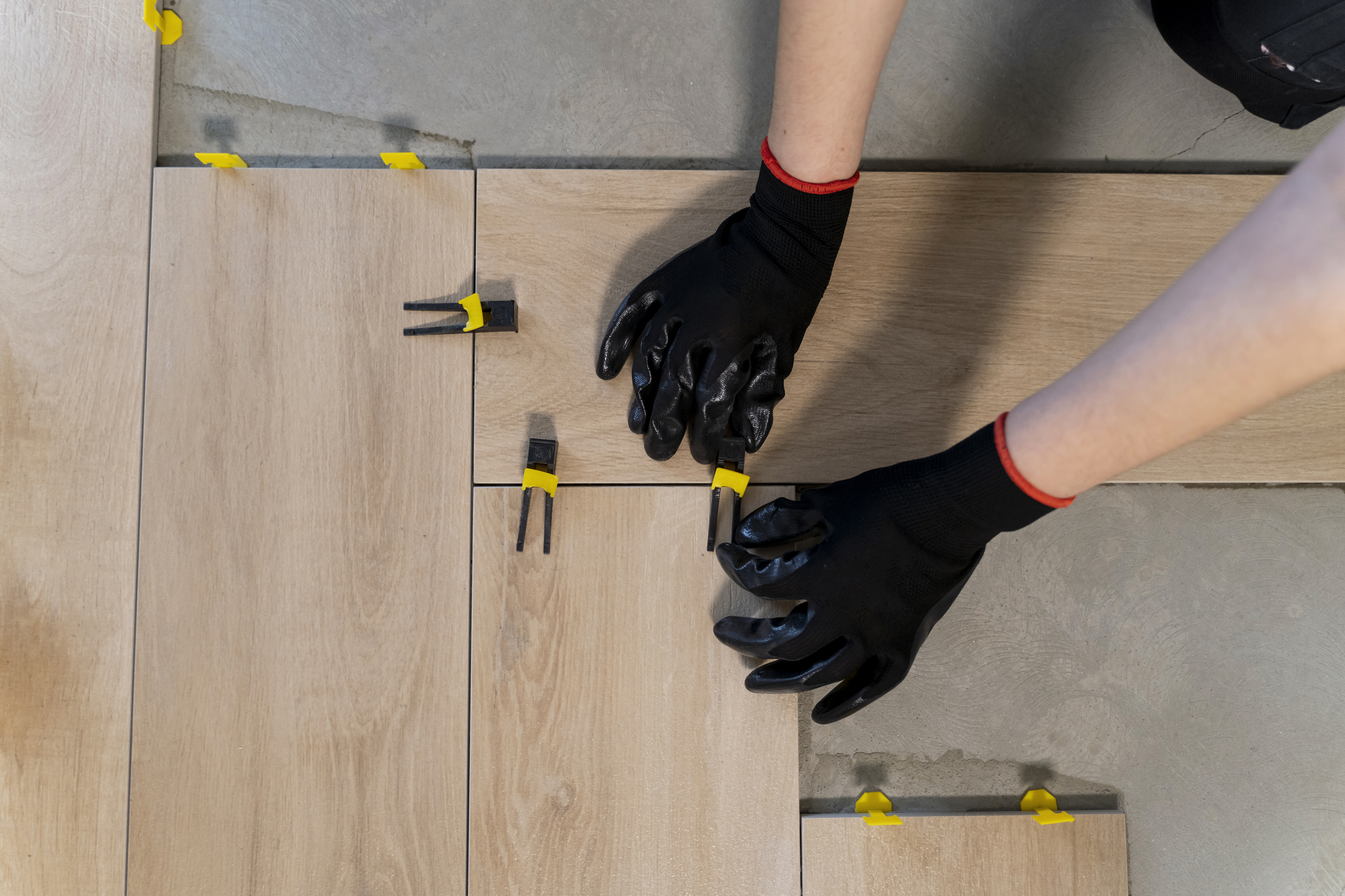 low-angle-man-tiling